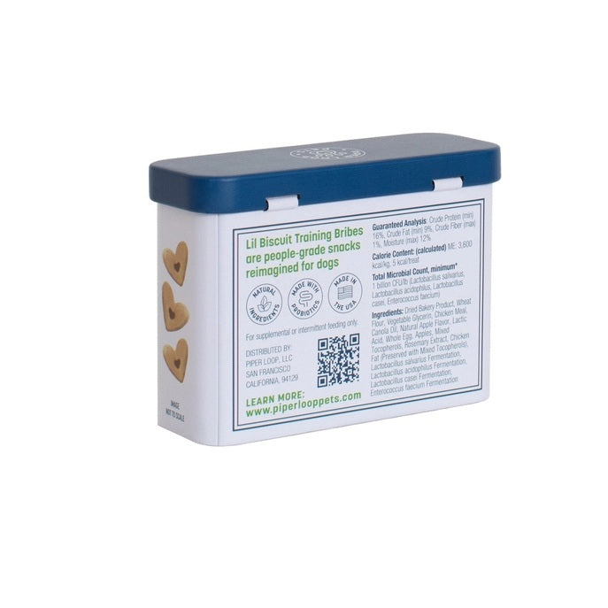 A rectangular, refillable tin labeled "PIPER LOOP PETS - LIL BISCUIT TRAINING BRIBES, CHEWY CHICKEN & APPLE," with a dog in a green sweater—chewy USA-sourced dog treats. Shake the tin, they come running!.