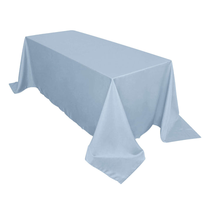 Light blue tablecloth draped over a rectangular table