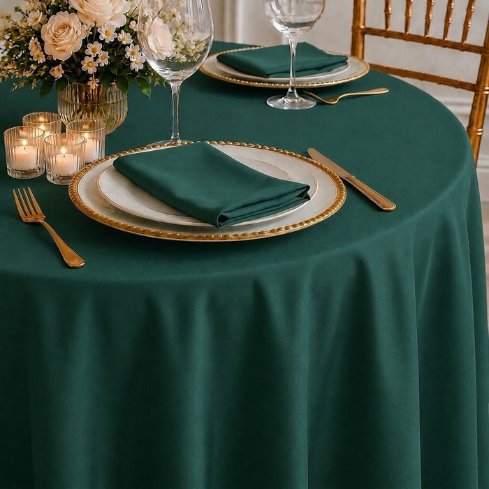 Hunter emerald green round tablecloth for elegant dining settings.