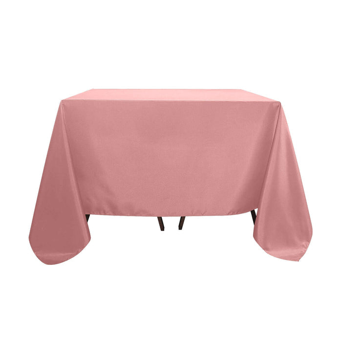 Pink tablecloth draped over a table, showcasing smooth fabric texture.