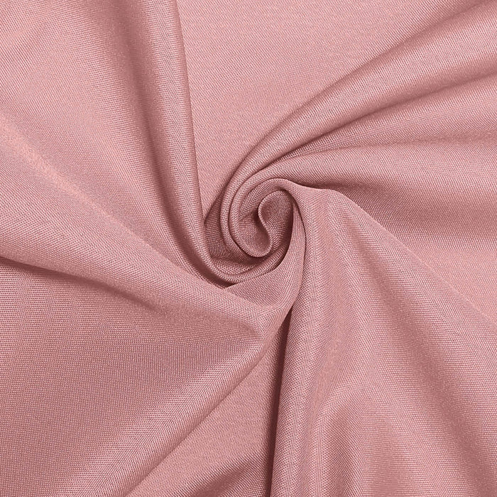 Pink fabric with a smooth texture in a swirling pattern. #whtbkgd