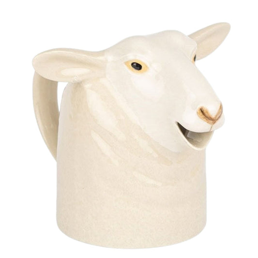 The QUAIL CERAMICS - WHITE SUFFOLK SHEEP JUG by QUAIL DESIGNS is a sheep-shaped ceramic jug, off-white with painted details, featuring a handle and top opening—ideal for adding farmhouse charm to your kitchen.