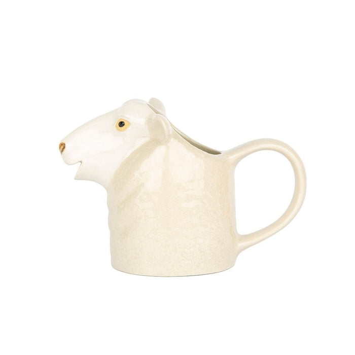 The QUAIL DESIGNS QUAIL CERAMICS - WHITE SUFFOLK SHEEP JUG features a sheep’s head with a handle and open mouth for pouring. Its cream color and detailed design add charm to any farmhouse-style kitchen.