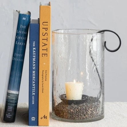 The RECYCLED BUBBLE GLASS HURRICANE WITH METAL VOTIVE HOLDER by CREATIVE COOP features artisanal textured recycled glass and a metal votive holder, beautifully displayed against a crisp white background.