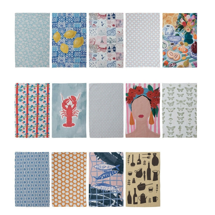Thirteen CREATIVE COOP RECYCLED MICROFIBER TEA TOWELS, each featuring a unique design—lemons, seafood, butterflies, abstract motifs, dishes, and a woman with a floral headdress—are arranged in three rows on a white background.