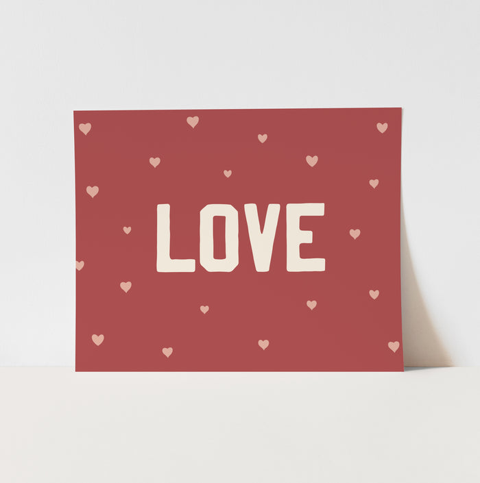 Card with 'LOVE' text and heart patterns on a red background