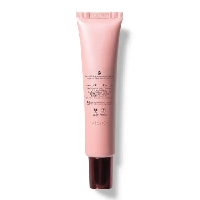 Pink skincare tube on a white background
