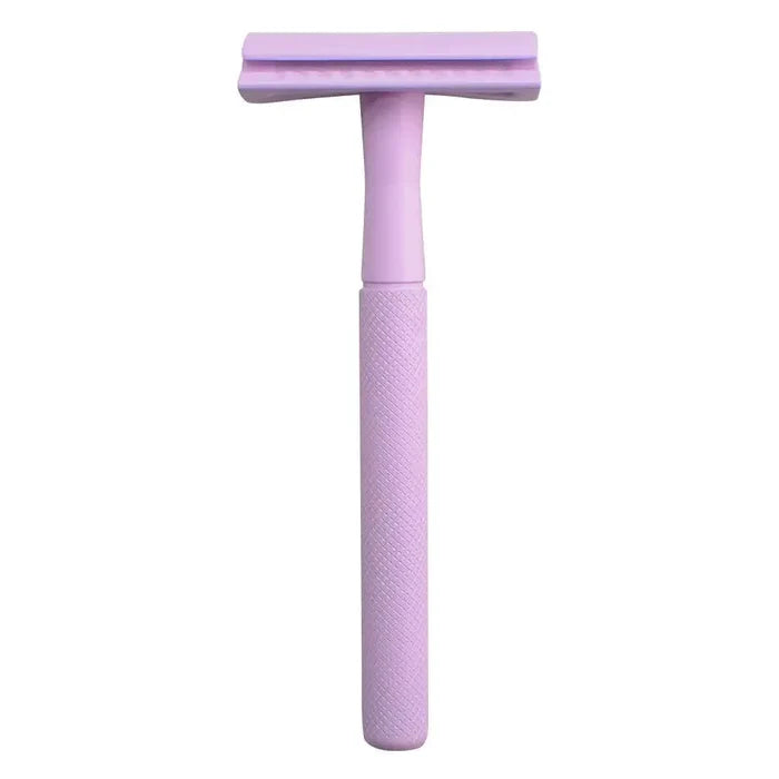 Purple safety razor on a white background