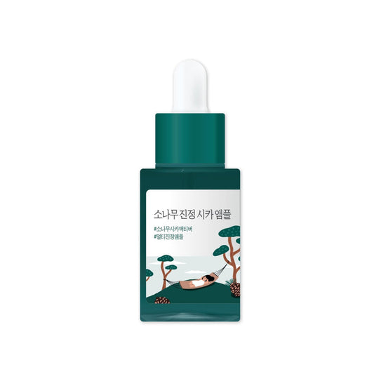 ROUND LAB Pine Calming Cica Ampoule is a soothing and hydrating serum formulated with Pine Extract and Centella Asiatica Extract to calm irritated skin and strengthen the skin barrier. It features a combination of Hyaluronic Acid and its derivatives to deeply moisturize, while Asiaticoside, Asiatic Acid, Madecassoside, and Madecassic Acid provide additional calming and skin-repairing benefits. This ampoule is ideal for sensitive skin, promoting a balanced and healthy complexion.
