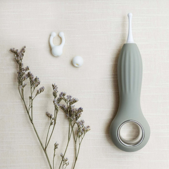 Samphire Precision Vibrator with interchangeable heads, ergonomic design, and premium silicone, styled with gentle florals.