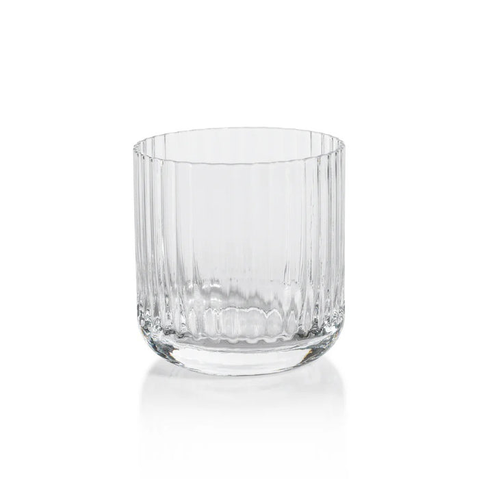 The SAVOY DOUBLE OLD FASHIONED GLASS by ZODAX, featuring clear ribbed glass with vertical ridges, sits on a white background and casts a soft reflection below.