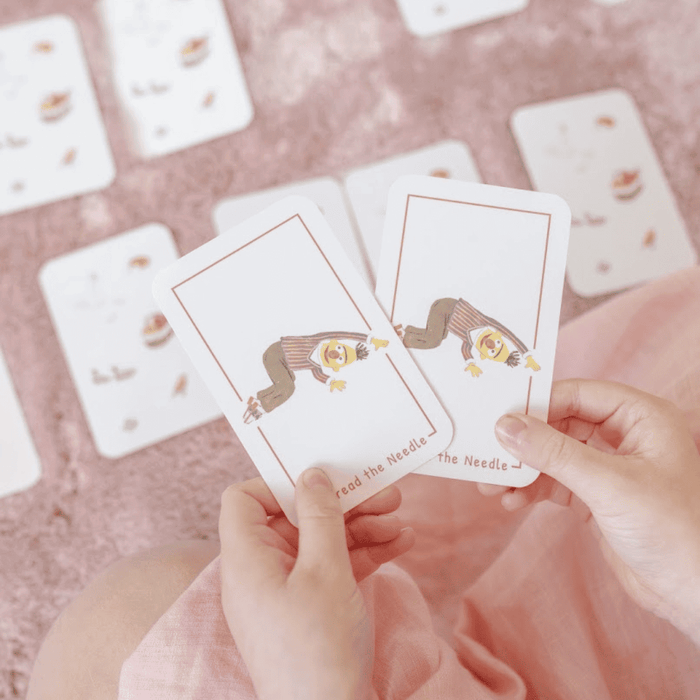 Two cards from the Sesame Street 3-in-1 Card Game showing characters and playful design on a pink background.