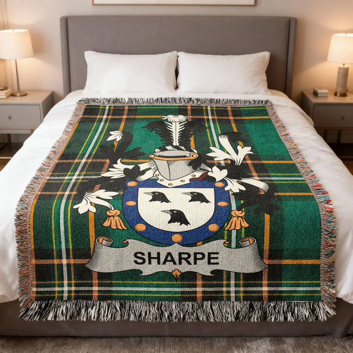 Sharpe Irish family crest woven blanket displayed on a bed.