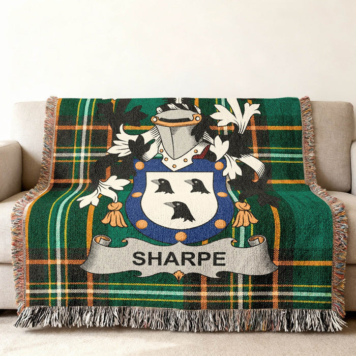 Sharpe family crest on an Irish National Tartan woven cotton throw.