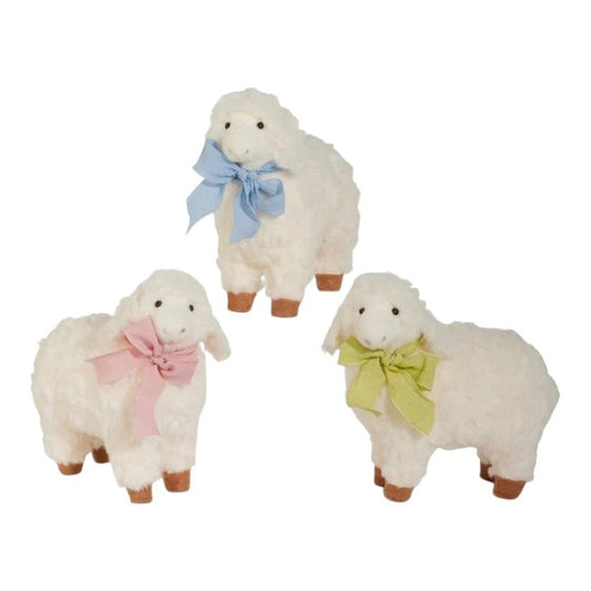 The RAZ IMPORTS SHEEP WITH BOW, 7”, features three fluffy white sheep with brown feet and blue, pink, or green bows—charming accents for whimsical home decor or spring decorating.