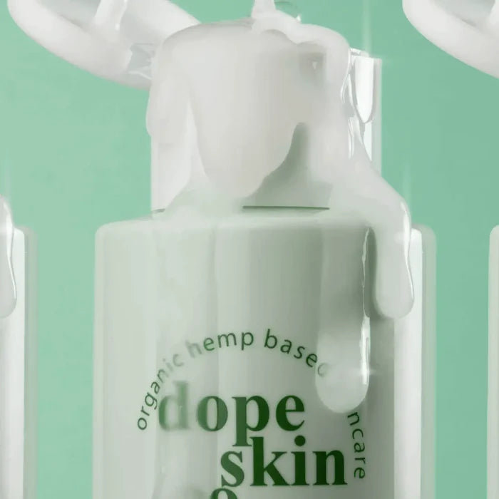 Bottle of 'dope skin' skincare product with green text on a light green background