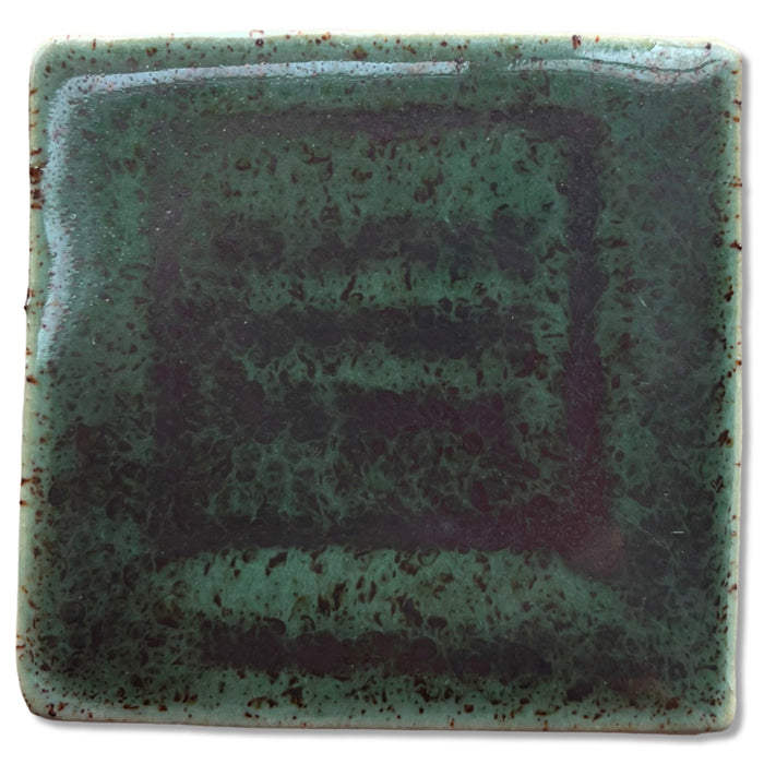 SP52 Shadow Green glaze test tile, glossy dark green with brown speckling and darker brushed bands