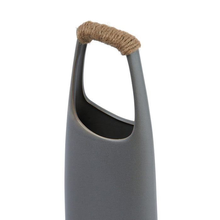 The CREATIVE COOP STONEWARE VASE WITH RATTAN WRAPPED HANDLE, GREY, stands tall with a matte finish and elongated oval opening, making a striking decorative centerpiece against a white background.