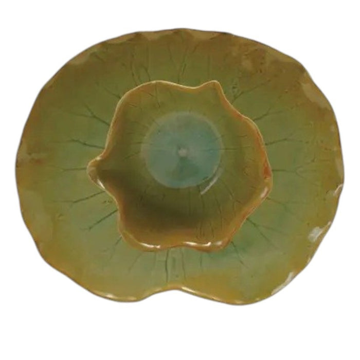 The CREATIVE COOP STONEWARE WATER LILY PLATE WITH BOWL IN REACTIVE CRACKLE GLAZE features veined, green leaf shapes and wavy edges, resembling natural leaves from the side view.