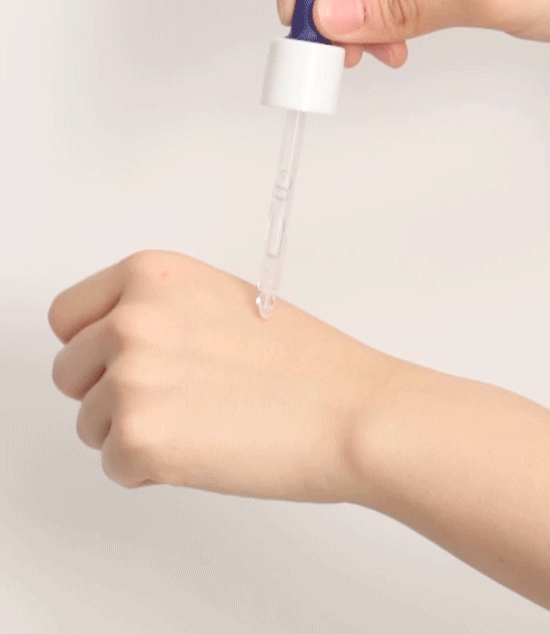 Video showing application of A blue glass ampoule with a dropper, labeled 'Missha Super Aqua Ultra Hyalron Ampoule' against a white background.