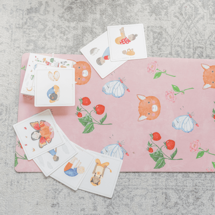 Sweet Print Kids Yoga Mat with colorful animal illustrations and playful cards on a soft surface.