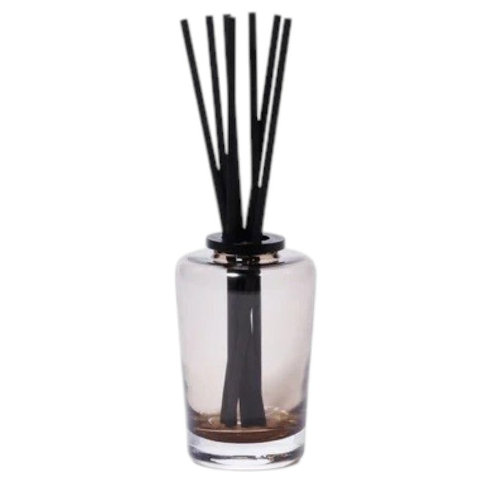 A black rectangular ZODAX gift box with a small label sits beside the THISTLE ESTATE DIFFUSER - 200 ML, featuring black reeds and scented liquid for a refreshing California coast fragrance.