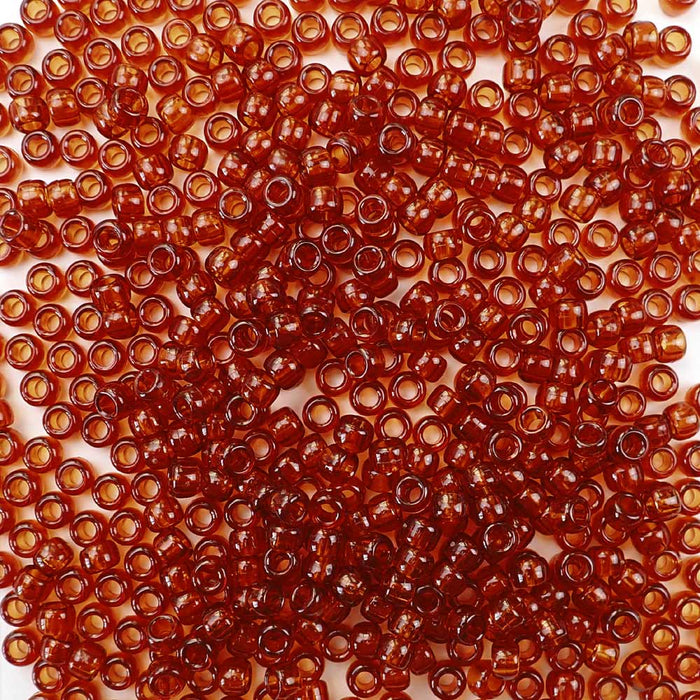 6 x 9mm plastic pony beads in transparent tortoise