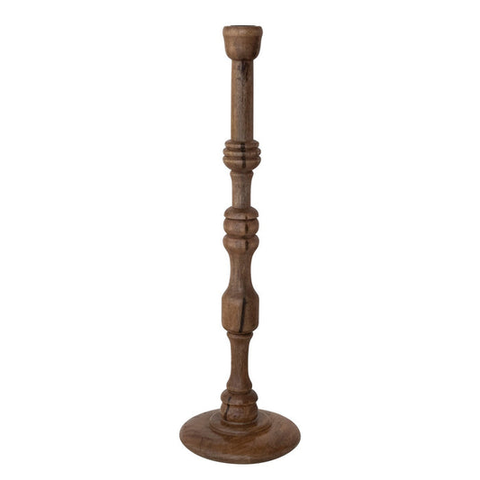 The TURNED MANGO WOOD TAPER HOLDER, MEDIUM by CREATIVE COOP features a tall, slender design with a round base, carved details, and a natural mango wood finish crafted in traditional turned woodwork.