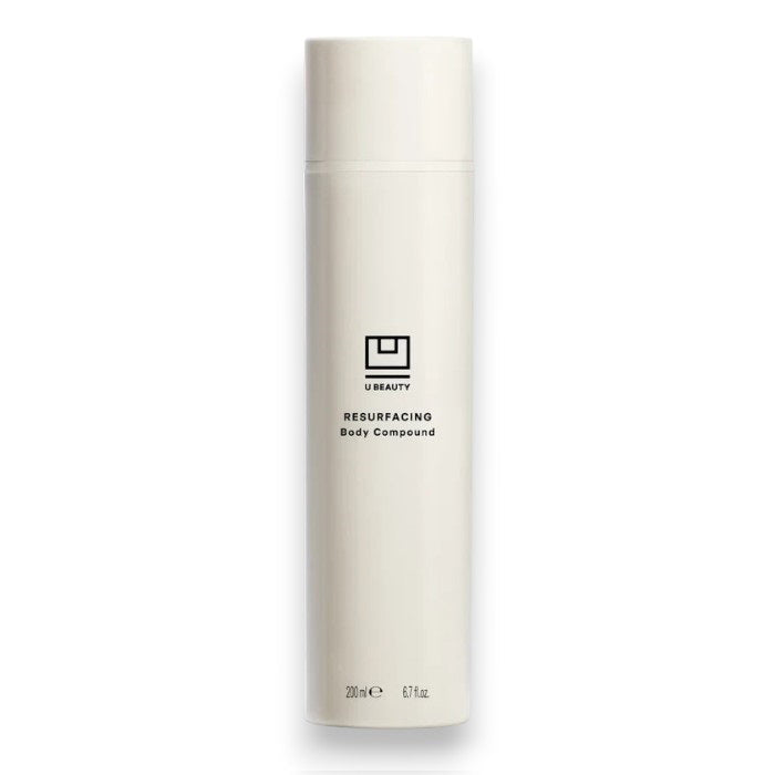 A tall, white bottle with a minimalist design and black text displays "U BEAUTY RESURFACING BODY COMPOUND 200ML." This body exfoliant is formulated to improve skin texture for a smoother look.