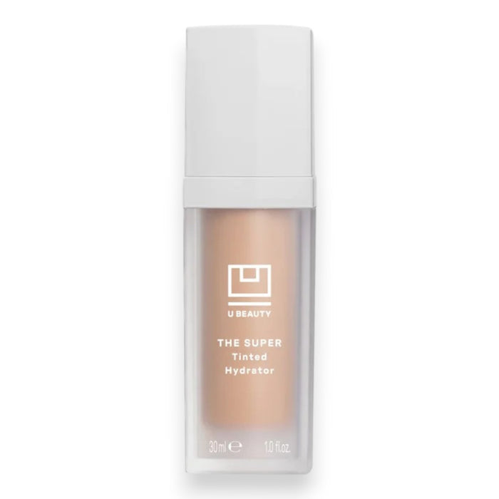 A bottle of U BEAUTY THE SUPER TINTED HYDRATOR SHADE 01 features a frosted base that reveals the moisturizer’s dewy finish, topped with a white cap and minimalist white labeling.