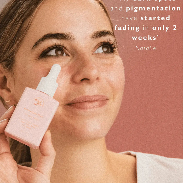 Woman applying skincare product with text about dark spot and pigmentation fading.