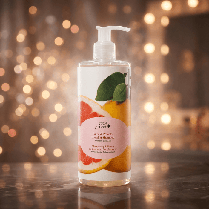 Shampoo bottle with a fruit-themed label on a wooden surface with a blurred light background